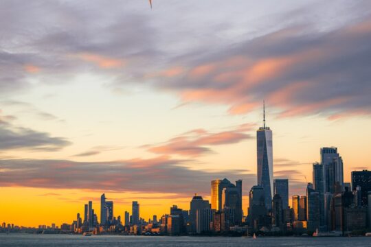a kite flies over a city