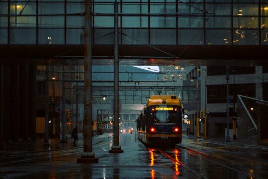 yellow and black bus on road during night time