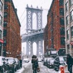 woman facing towards Brooklyn Bridge in New York