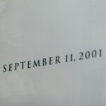 a close up of a plane flying in the sky