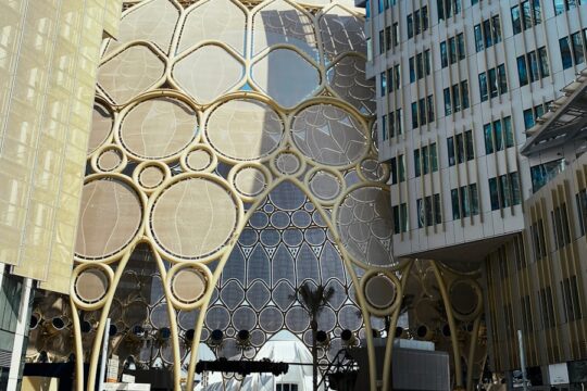 a couple of people standing in front of a building